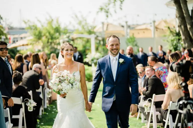 husband and wife walk down aisle at San Juan island destination wedding
