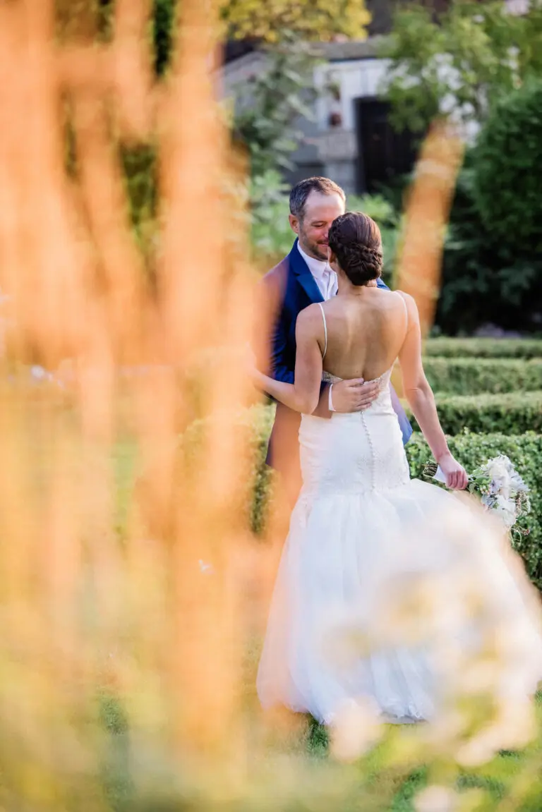 husband and wife hold hands at San Juan island wedding