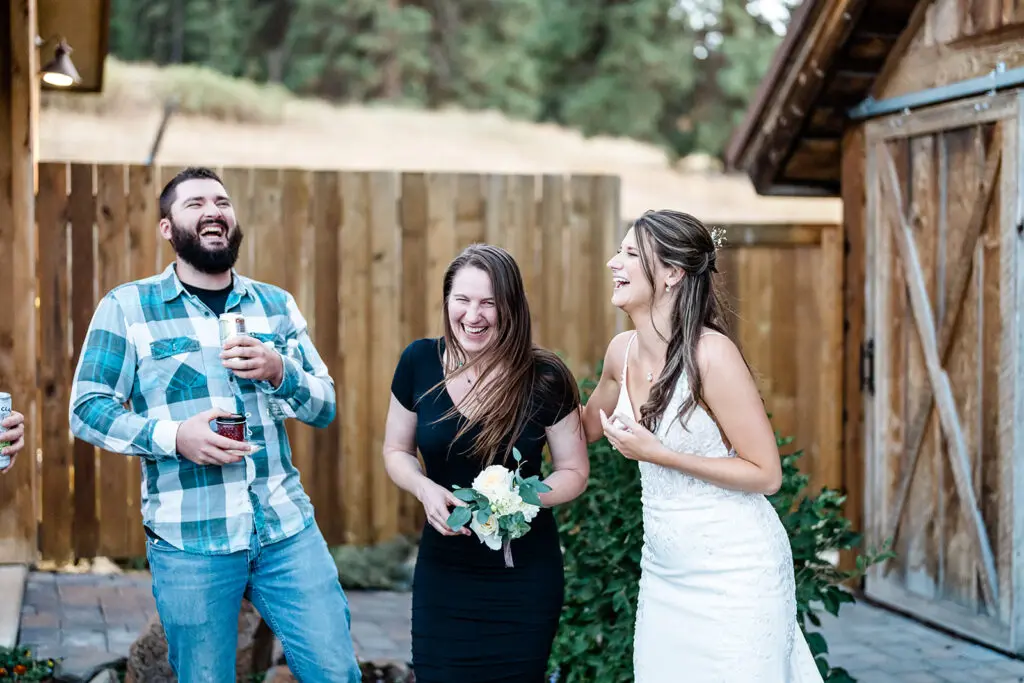 Bride throwing her flower at a Cattle Barn Wedding