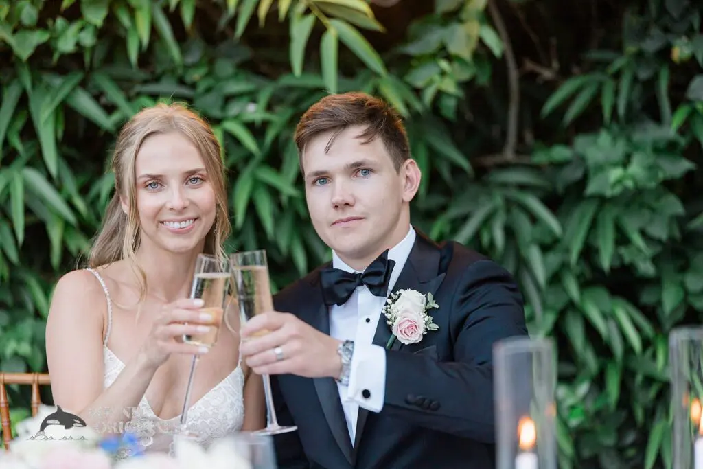 The bride and groom share a toast at The Palms Hotel & Spa Wedding