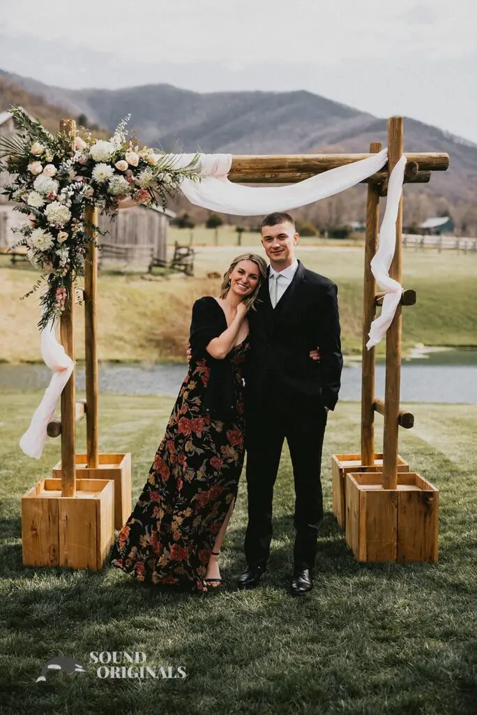 Handsome groom with big sister in front of Stoneyman Valley Ranch Wedding altar