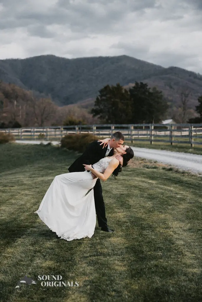 Bride and groom share sumptuous kiss after a successful Stoneyman Valley Ranch Wedding