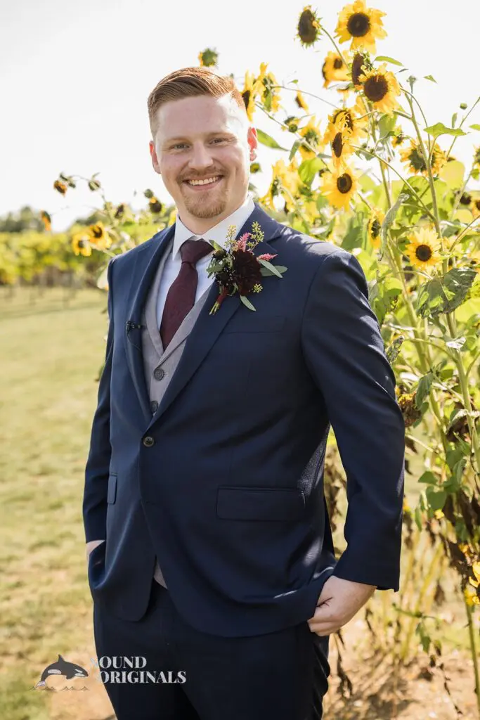 happy groom near sunflower fields at Folino Estate Winery