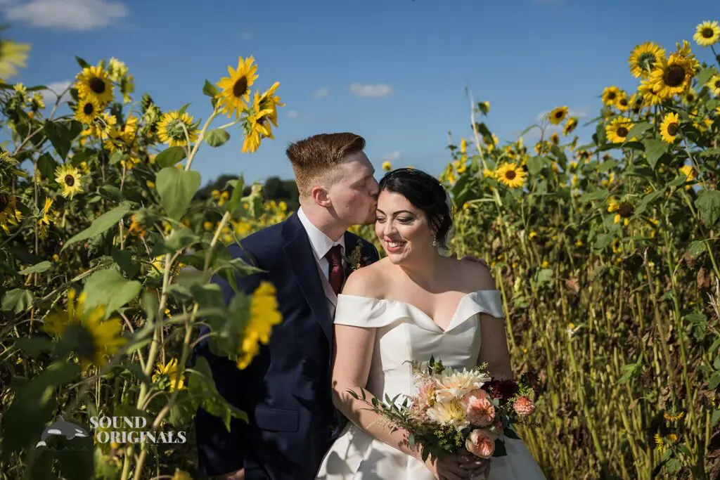 Couple in love in the middle of the sunflower field at Folino Estate Winery