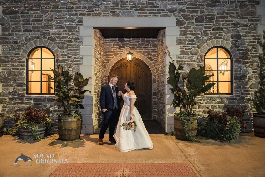 Couple hand in hand at the entryway of the villa at Folino Estate Winery