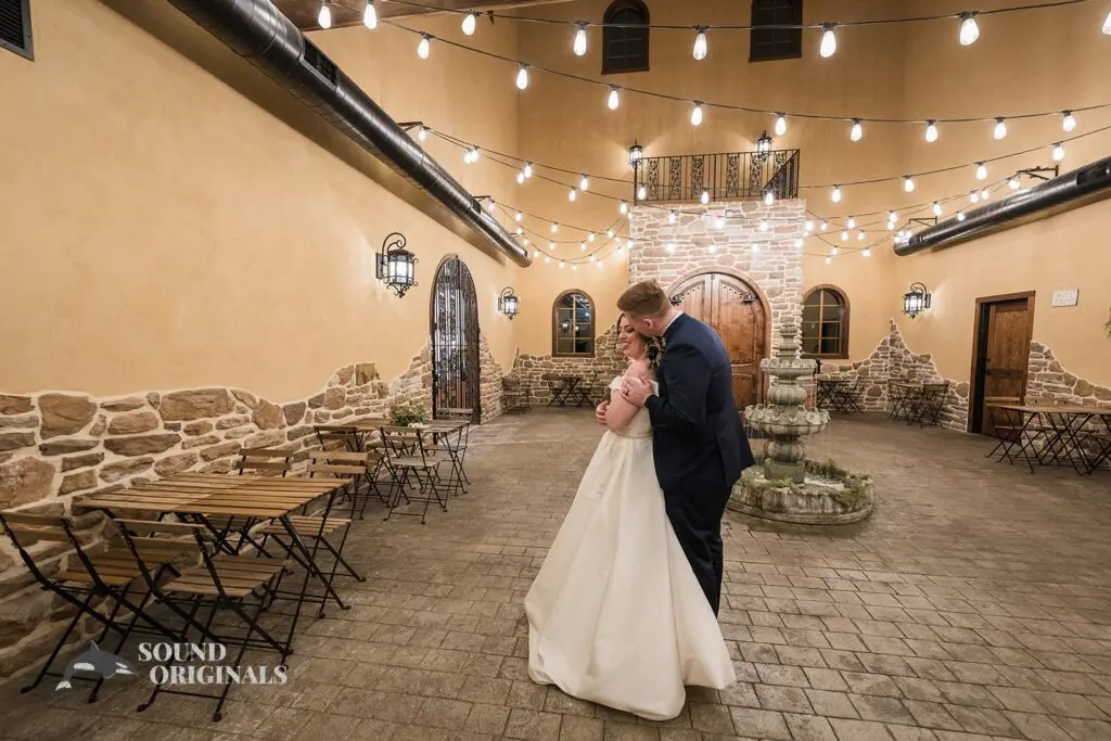 Newlyweds embracing at Folino Estate Winery