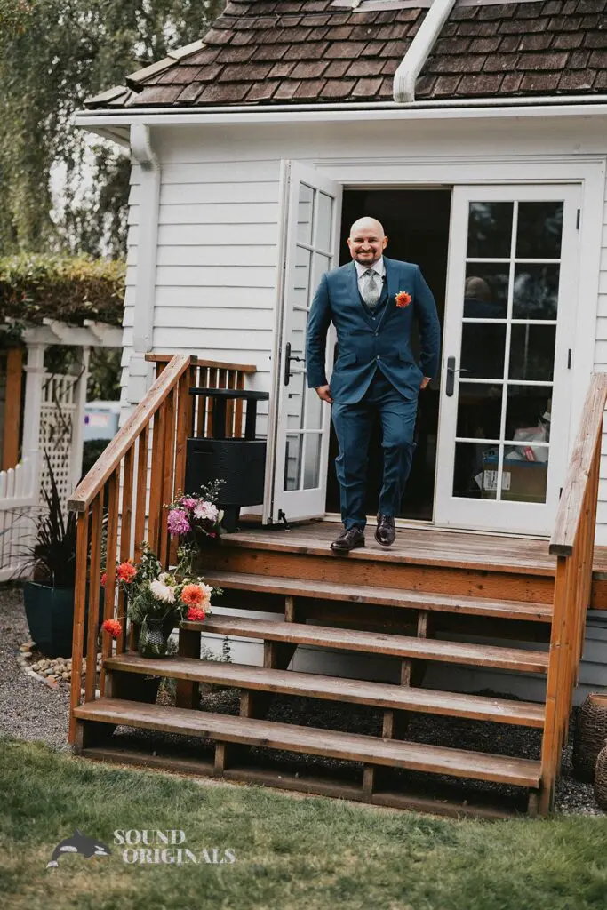 Husband walks down the stairs of The Carey Gardens