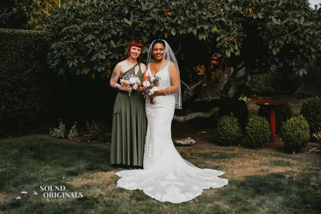 Beautiful bride with a best friend at The Carey Gardens