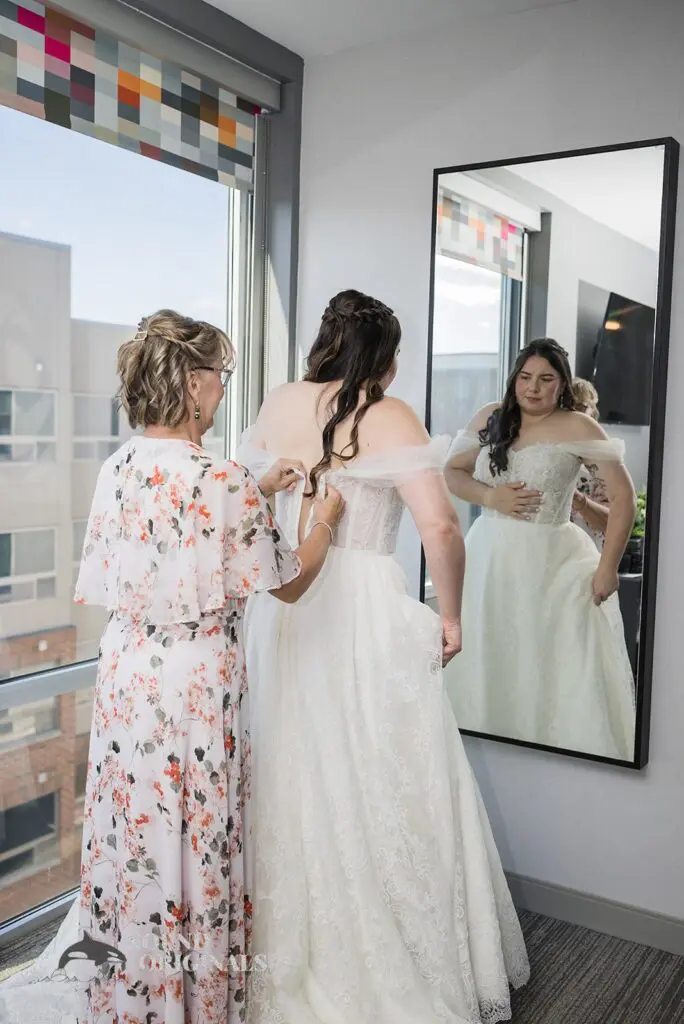 Bride fitting her wedding gown at Willow Heights