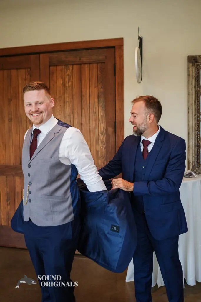 Groomsman helping groom get set for his big day at Folino Estate Winery