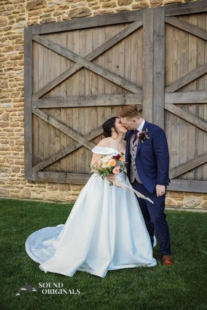 husnad and wife kiss at Folino Estate Winery