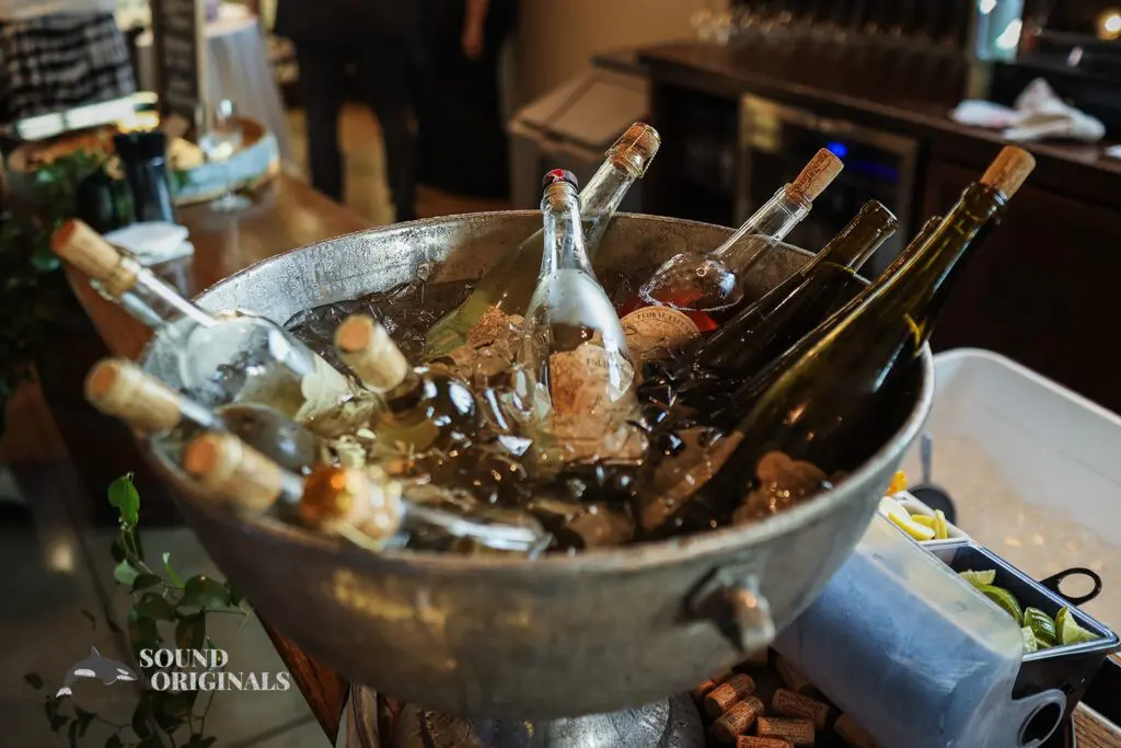 Bottles of wine submerged in a big bowl of water and ice at Folino Estate Winery