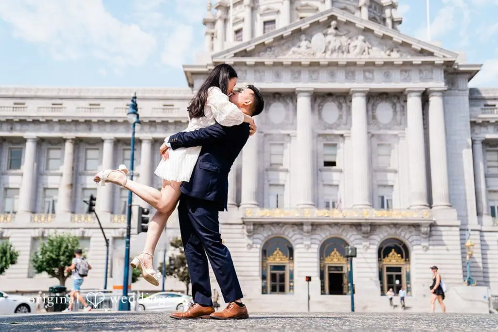 Engagement photo at San Francisco City Hall, one of the 24 Best Places for Engagement Photos in San Francisco, captured by our San Francisco wedding photography & videography team.