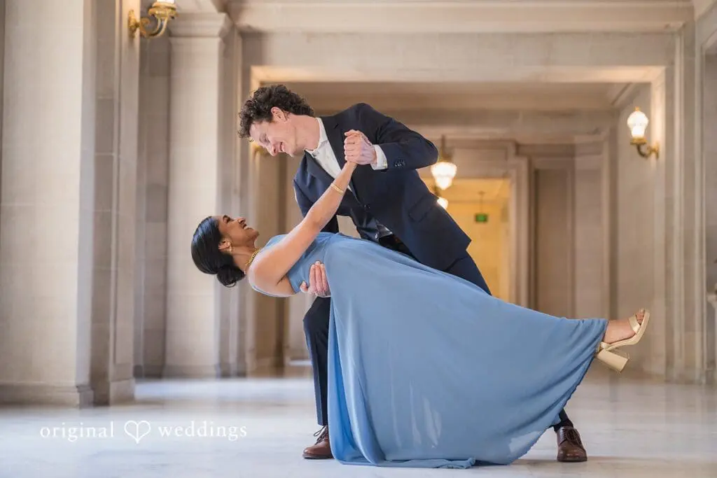 Engagement photo at San Francisco City Hall, one of the 24 Best Places for Engagement Photos in San Francisco, captured by our San Francisco wedding photography & videography team.