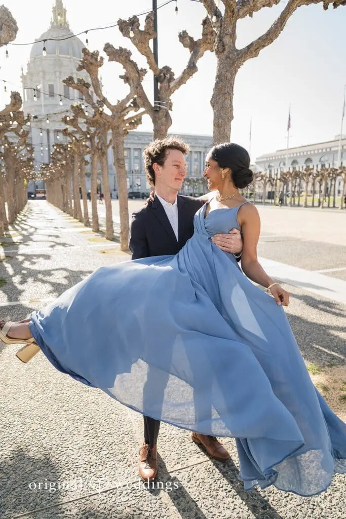 Engagement photo at San Francisco City Hall, one of the 24 Best Places for Engagement Photos in San Francisco, captured by our San Francisco wedding photography & videography team.
