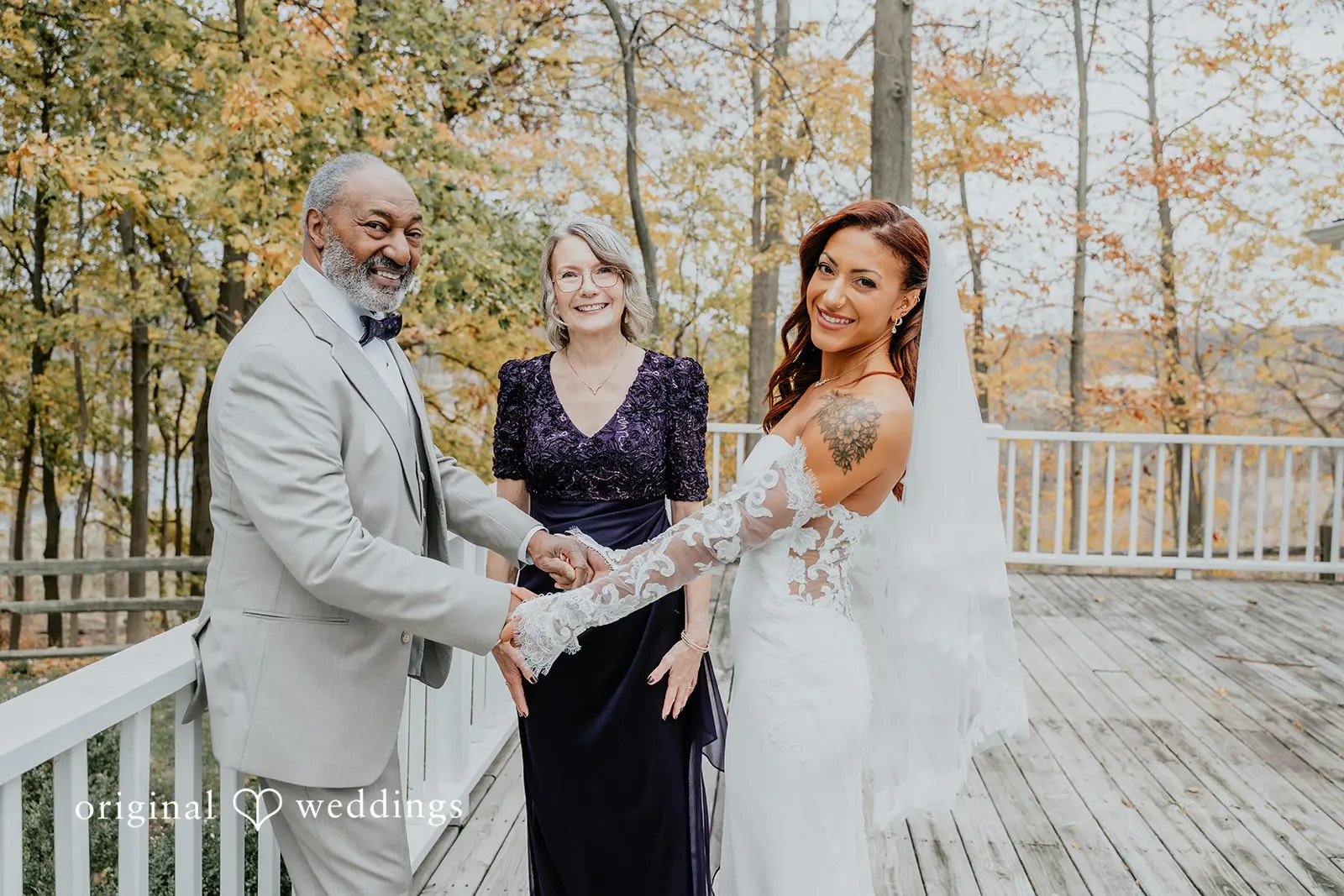 Kamaria + Chris A beautiful portrait of the bride with her father and a wedding guest