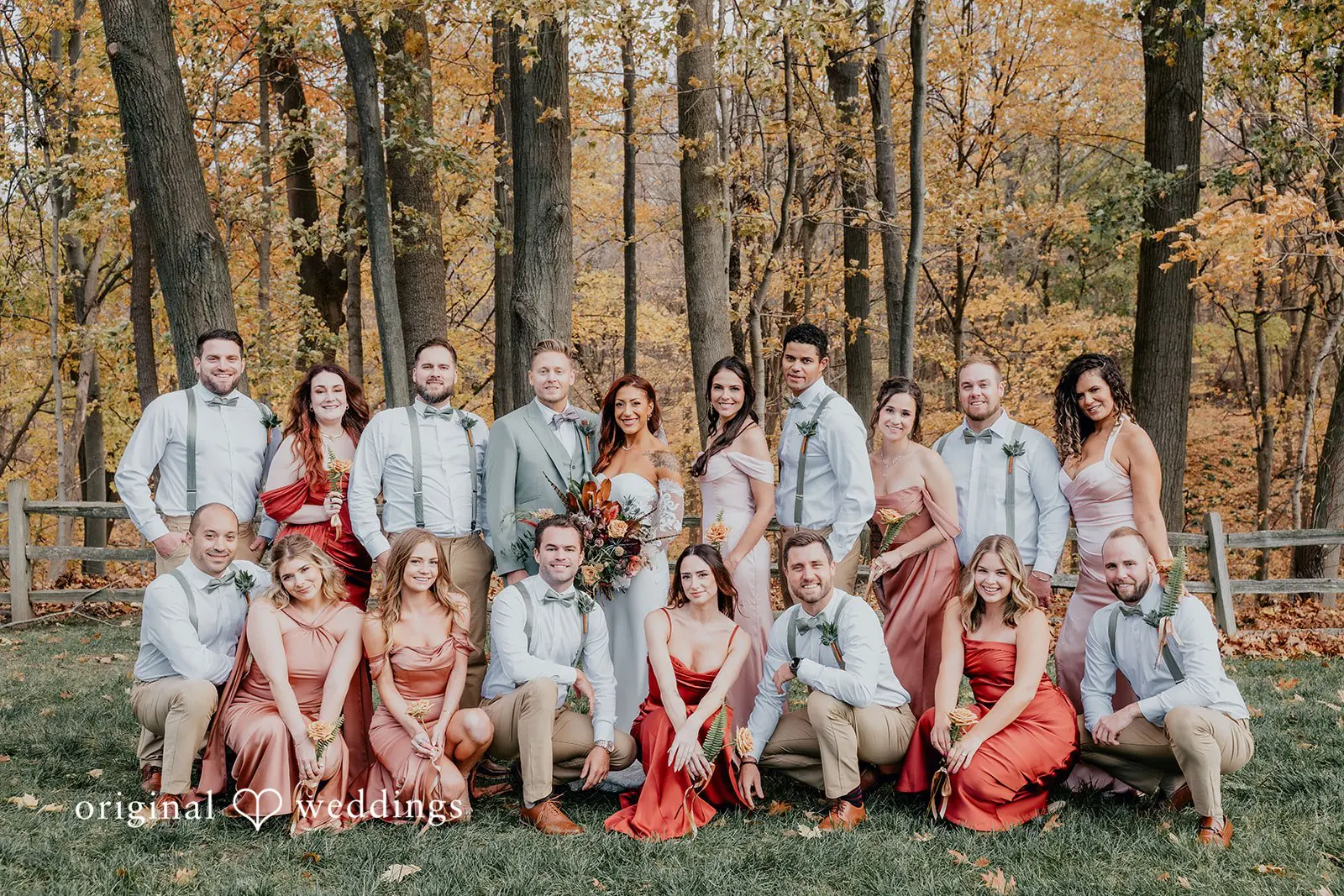 Kamaria + Chris Our Chicago wedding photographer at Original Weddings captured a stunning portrait of the couple with their bridal party at the Apple Blossom Resort