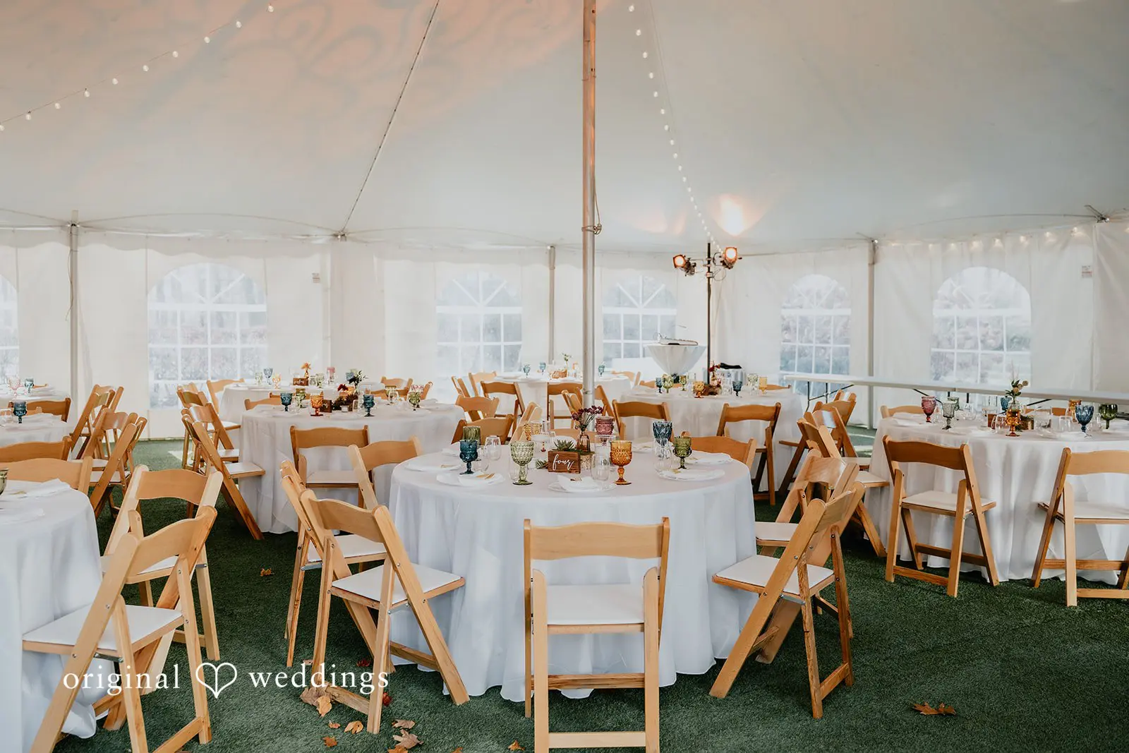 Kamaria + Chris Neatly decorated tables at Apple Blossom Resort wedding reception