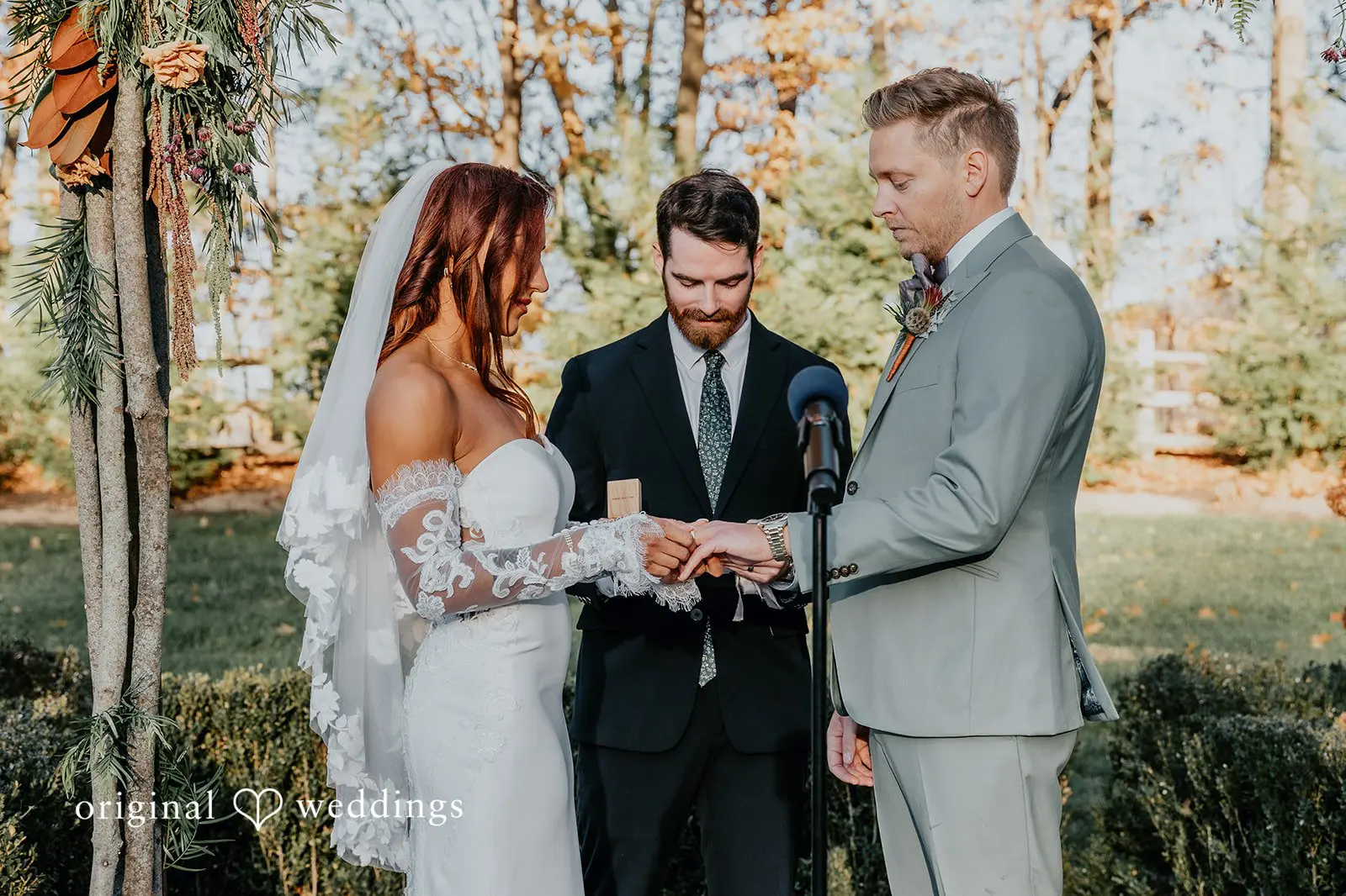 Kamaria + Chris The bride about to put the ring on the groom’s finger