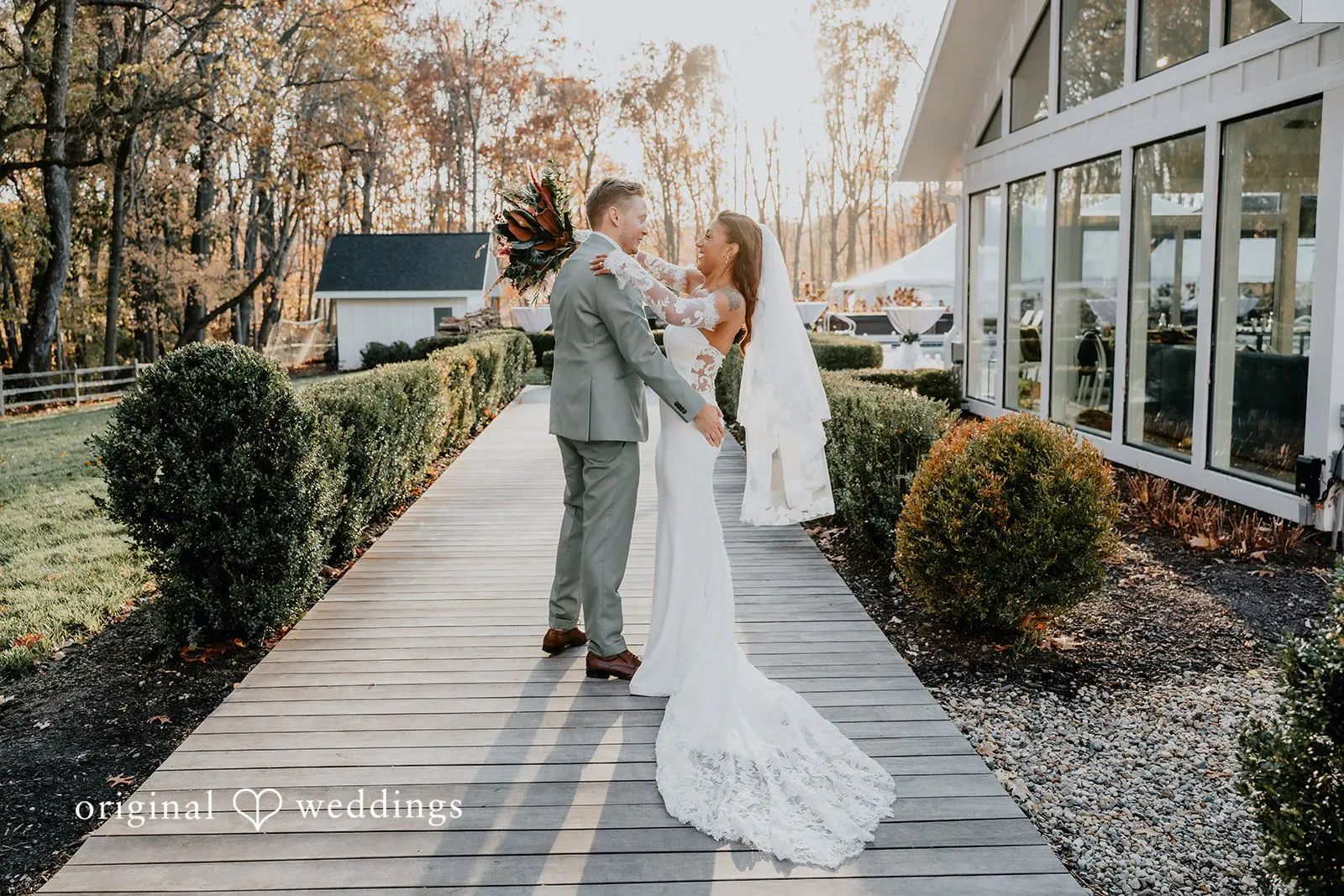 Kamaria + Chris A happy portrait of the bride and groom around Apple Blossom Resort's outdoor area