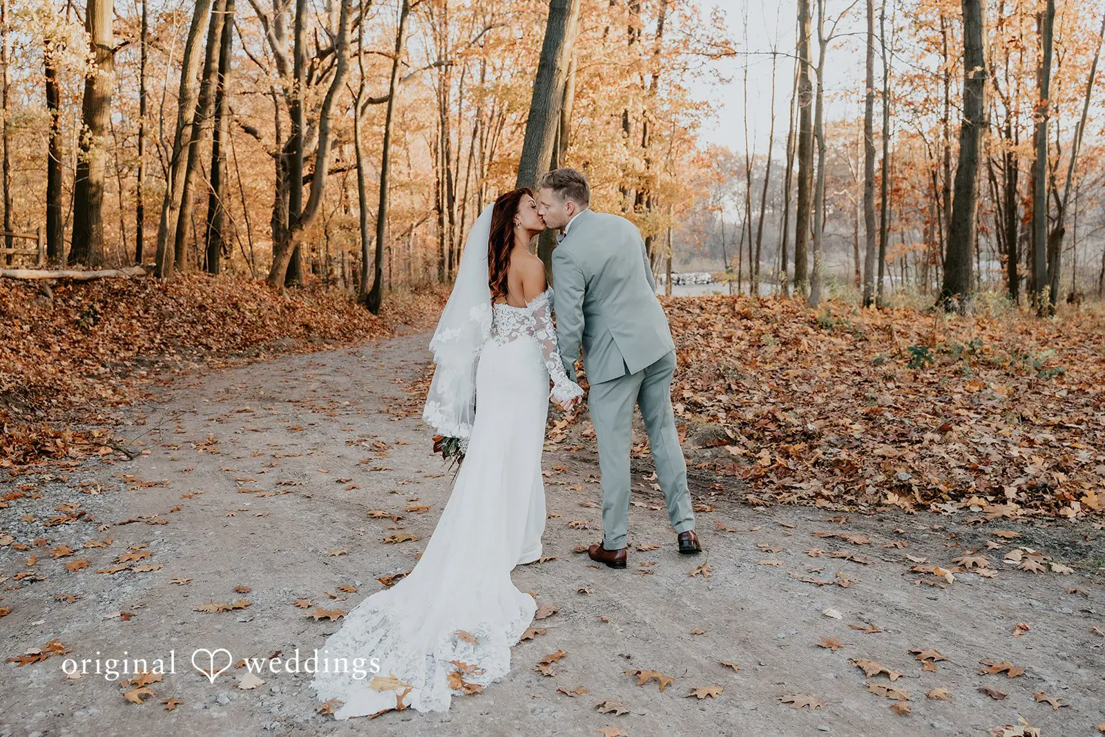 Kamaria + Chris The bride and groom share a kiss at the beautiful outdoor area of Apple Blossom Resort