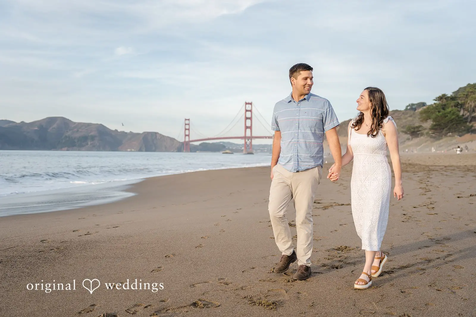 Daniel + Karen A portrait of the couple taking a walk along the beach