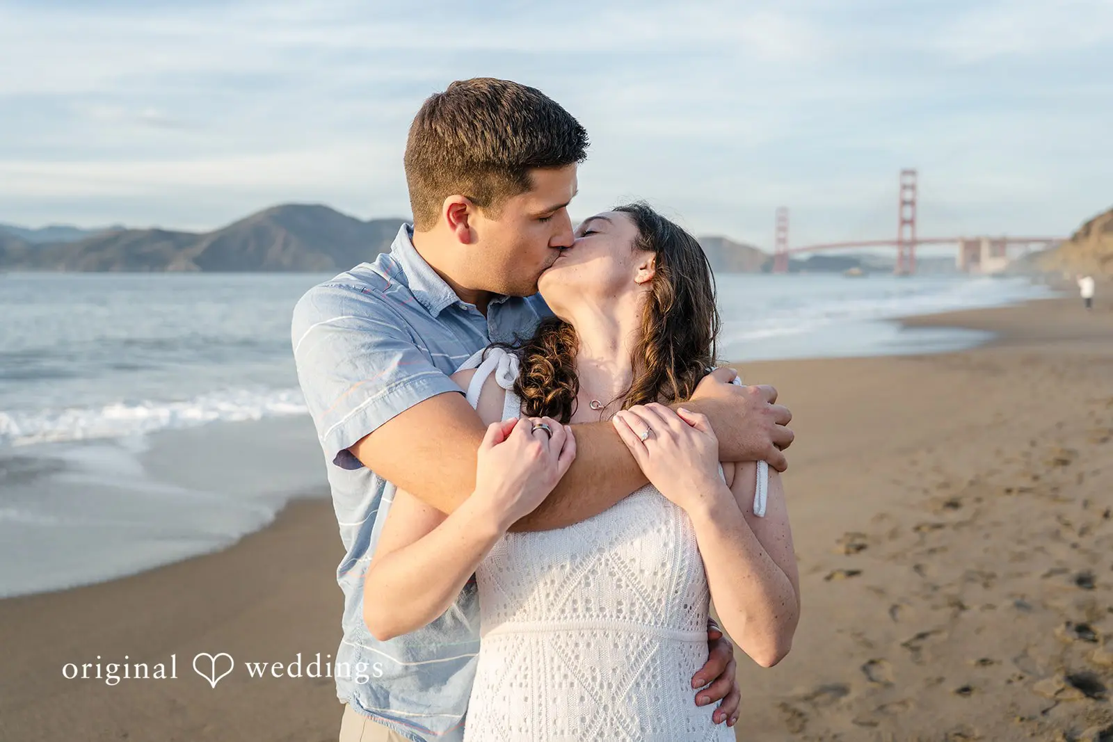 Daniel + Karen The couple shares a kiss at the beach