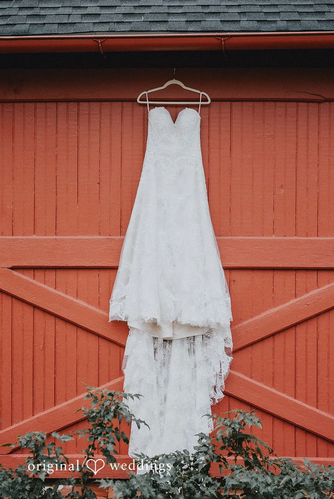 Stephanie + Zachary Bride's gown hanging gracefully at the barn at Bishop Farmstead