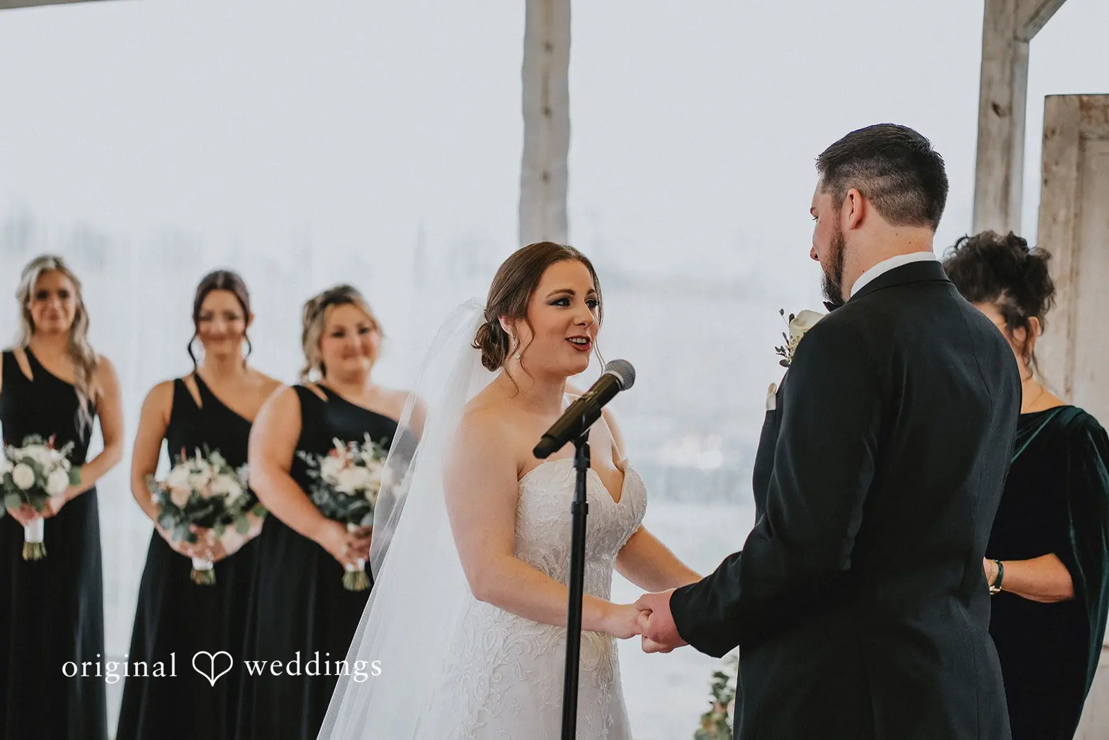 Stephanie + Zachary The groom and bride saying their marital vows at Bishop Farmstead