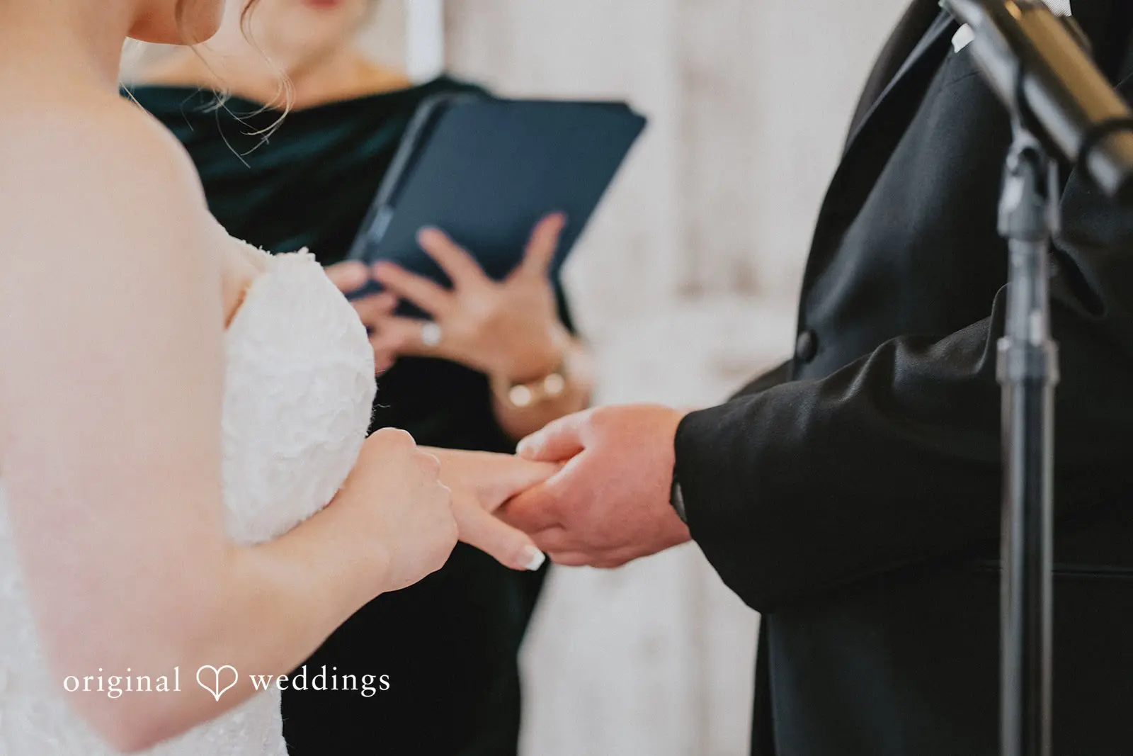 Stephanie + Zachary Our Philadelphia wedding photographer took a close-up shot of the bride and groom about to exchange wedding rings