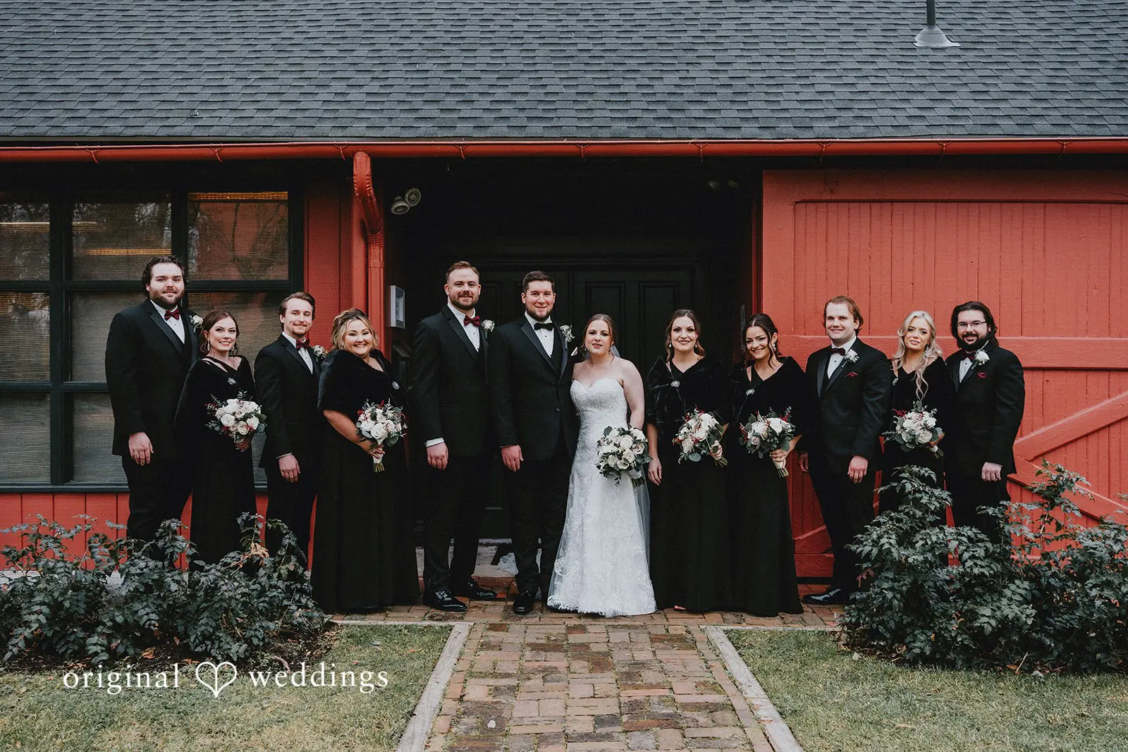 Stephanie + Zachary A portrait of the bride and groom with their bridal party