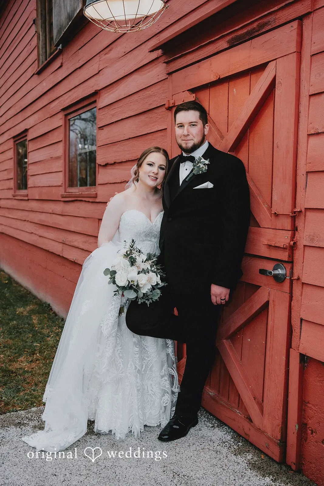 Stephanie + Zachary A portrait of the bride and groom at the red barn