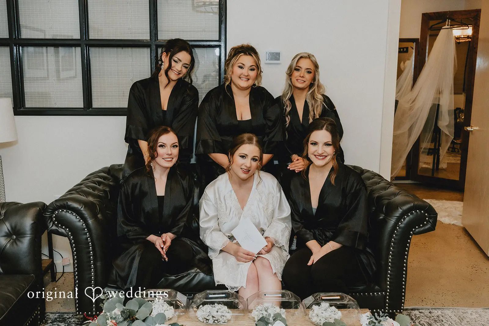 Stephanie + Zachary A portrait of the bride and her bridal party before the wedding ceremony.