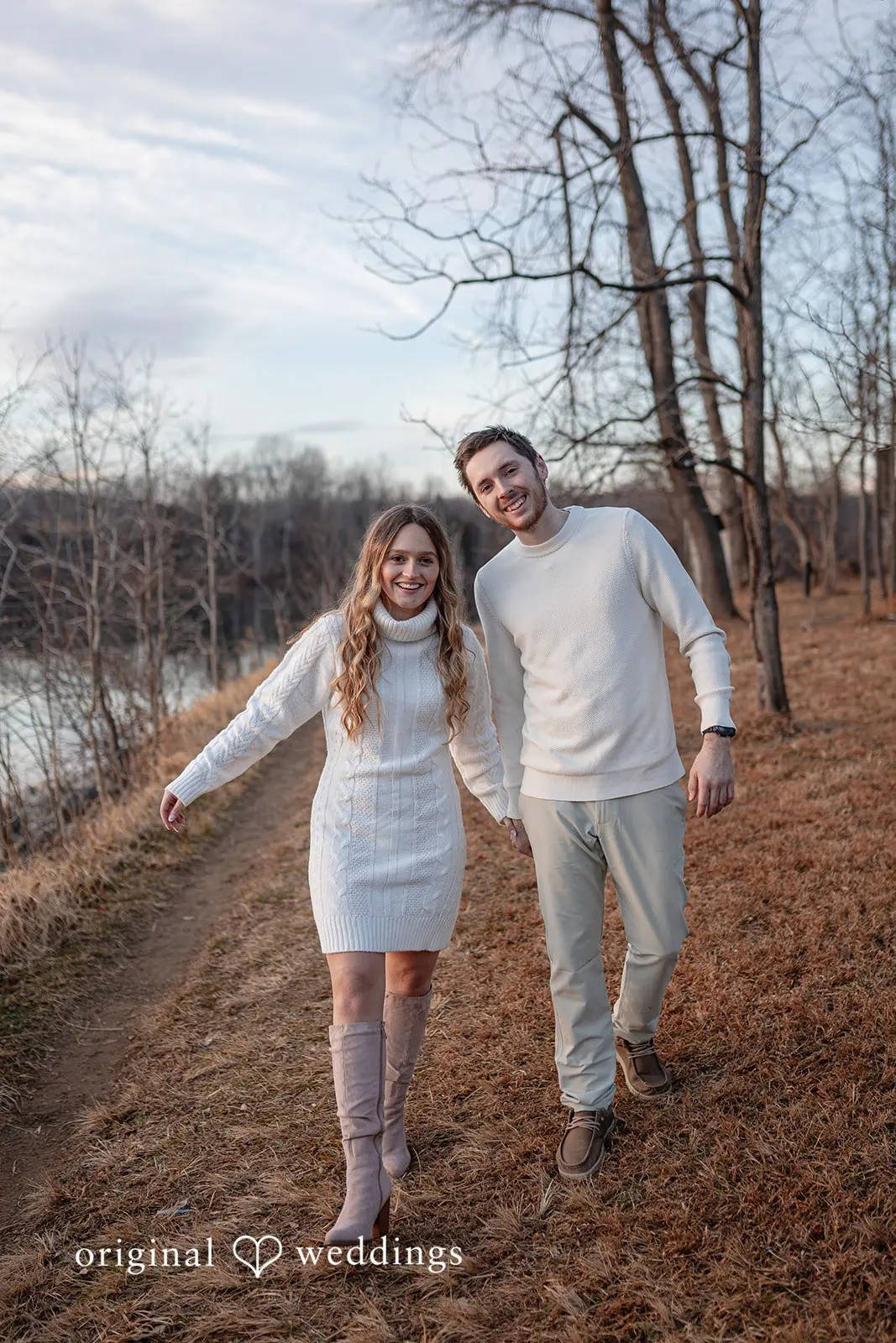 Rosemary + James The couple taking a walk by the water's edge