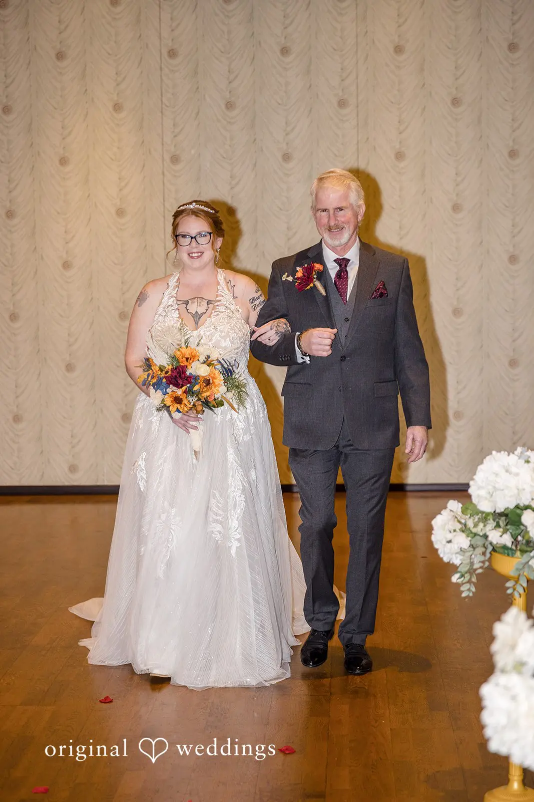 Bride's father escorts bride down the aisle at the Buck Hotel reception