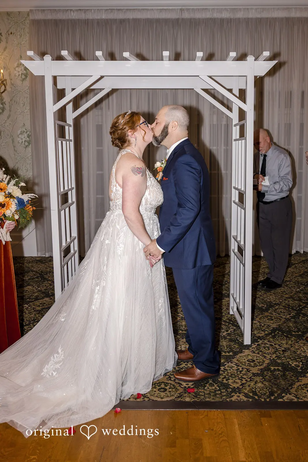 The bride and groom share their first kiss