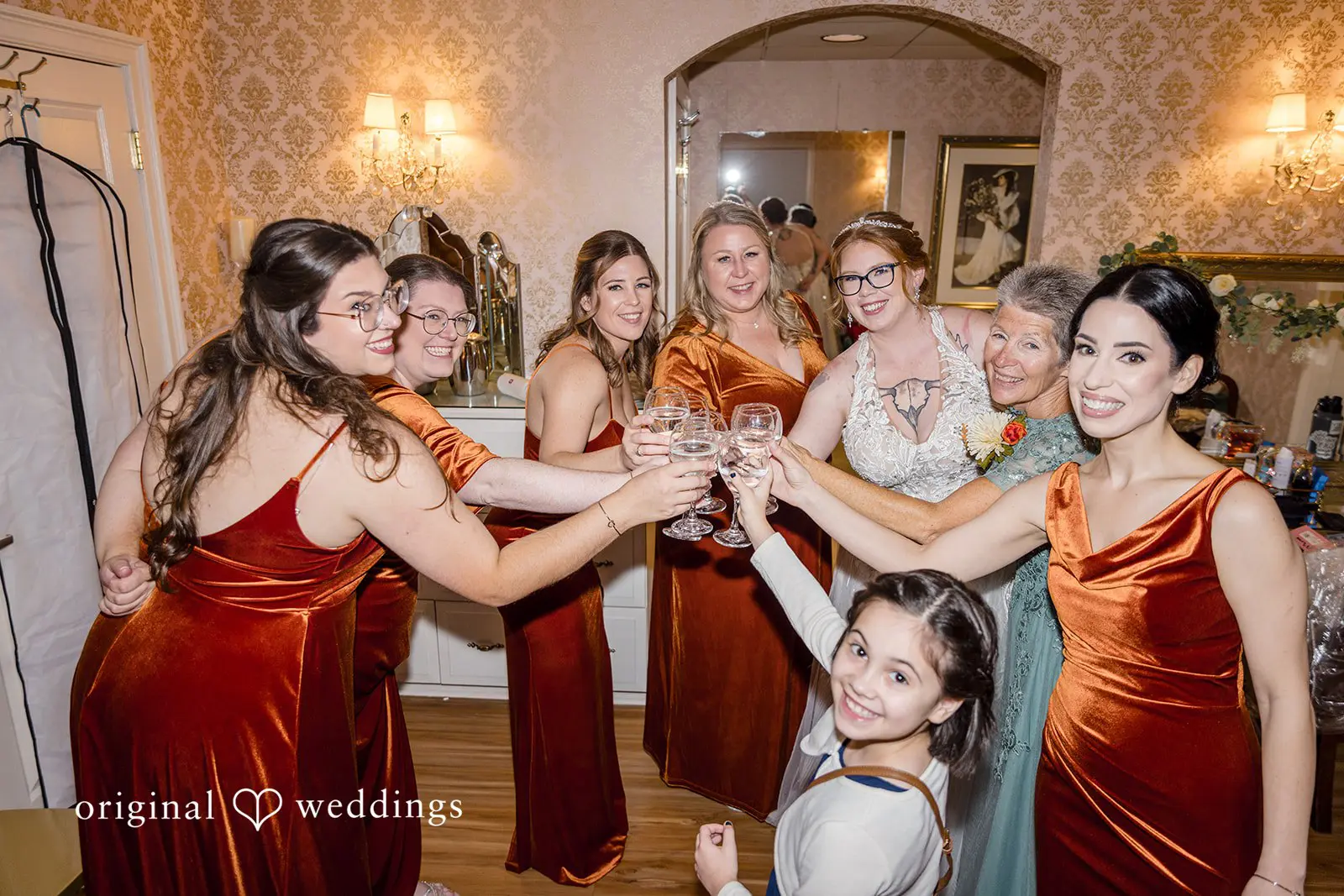 The bride and her bridesmaids having a nice time before the ceremony