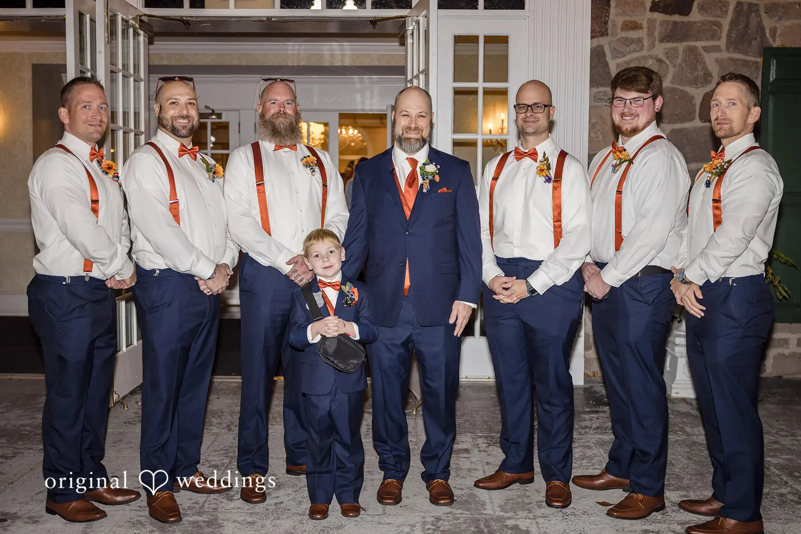 Our Philadelphia wedding photographer captures a stunning portrait of the groom with his groomsmen at the Buck Hotel