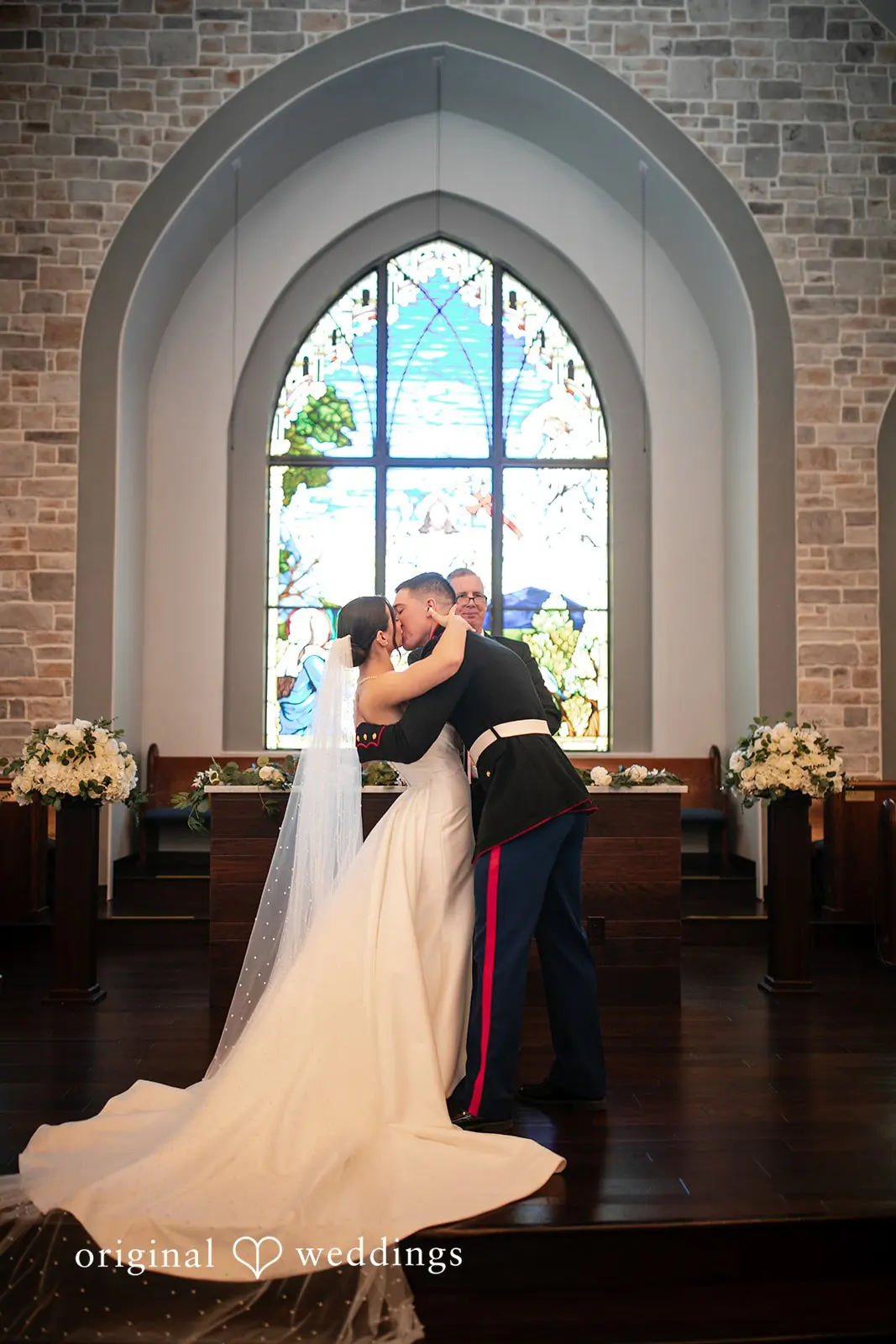Romantic first kiss after ceremony at Canterbury Hall Tampa wedding
