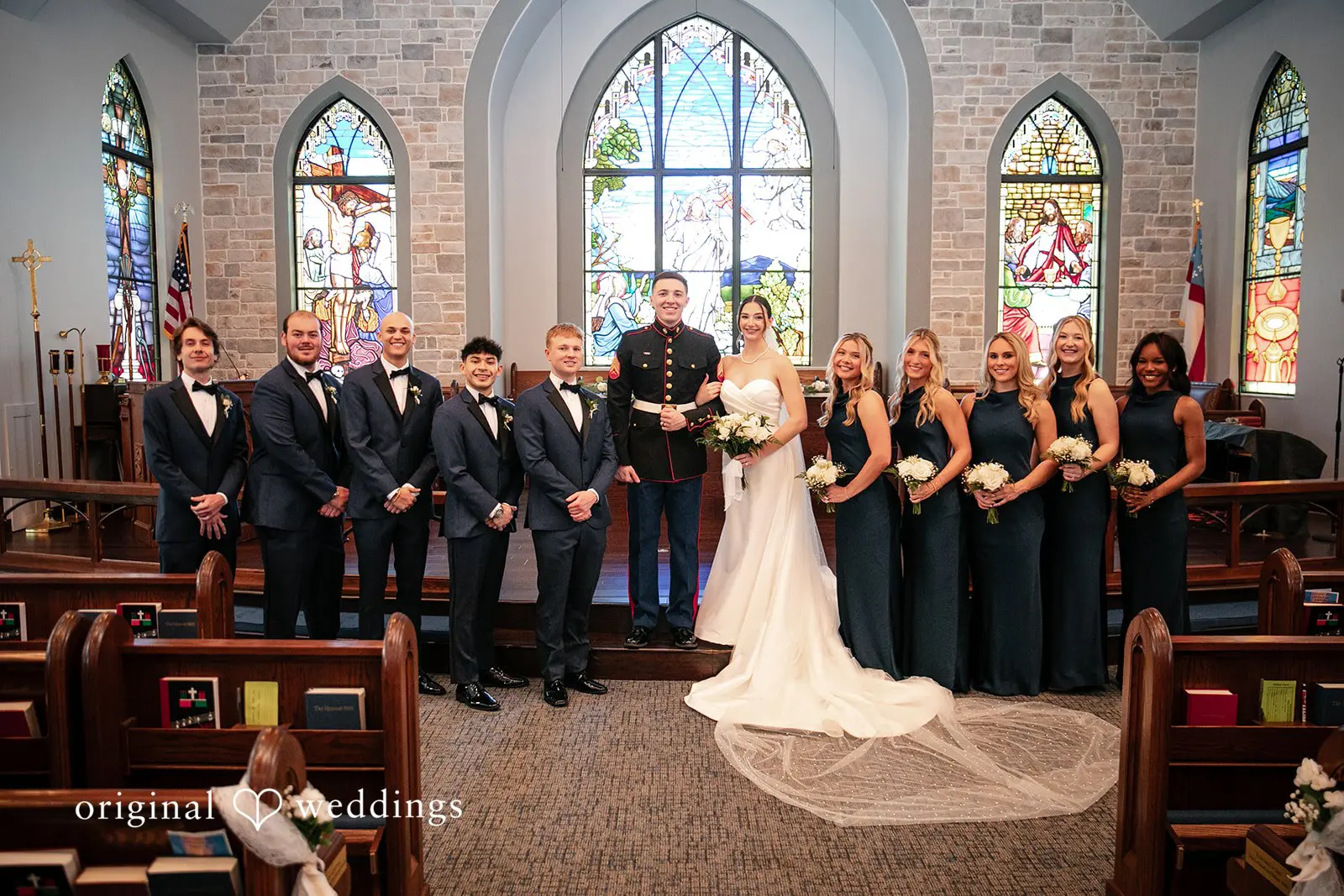 Stunning picture of couple with groomsmen and bridesmaids at Canterbury Hall Tampa wedding