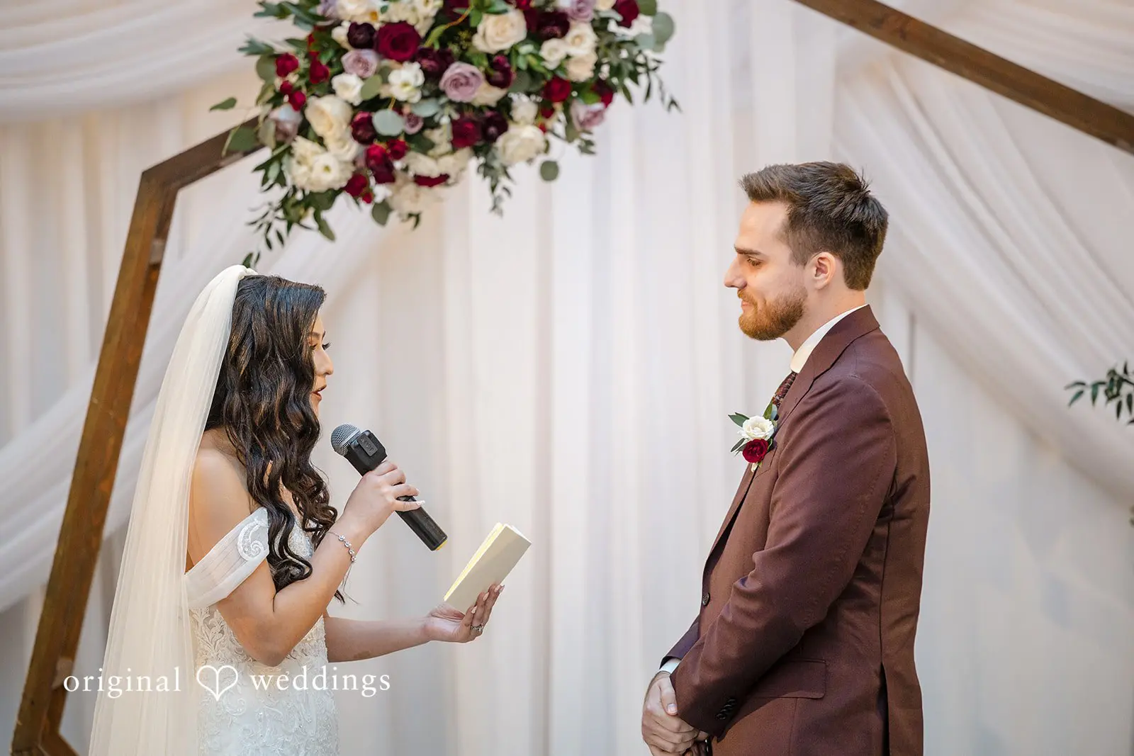 The bride reads her vows to the groom