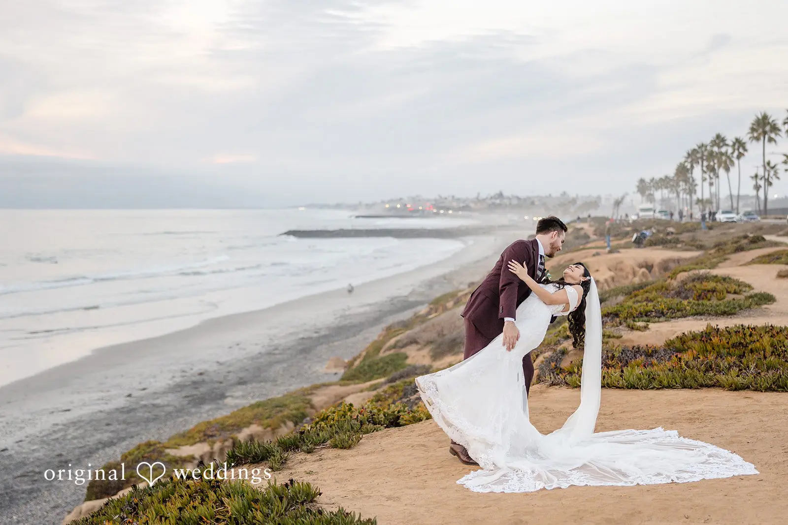 A romantic portrait of the couple at the waterfront
