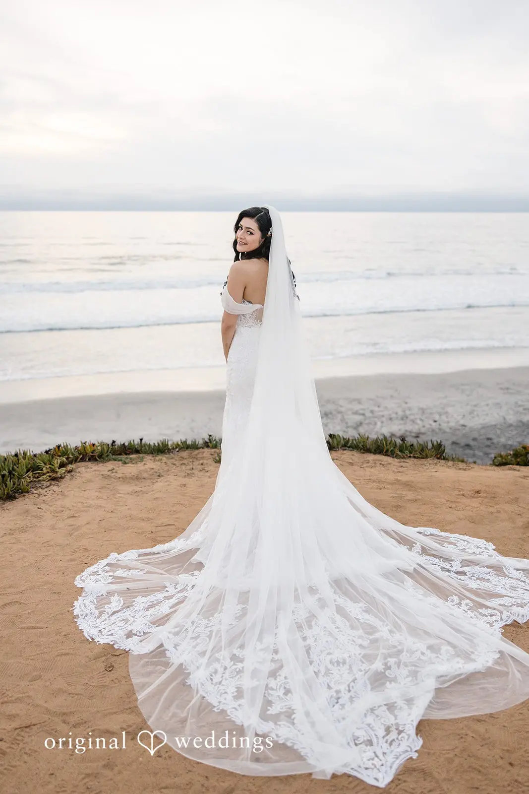 A photo of the bride by the waterfront