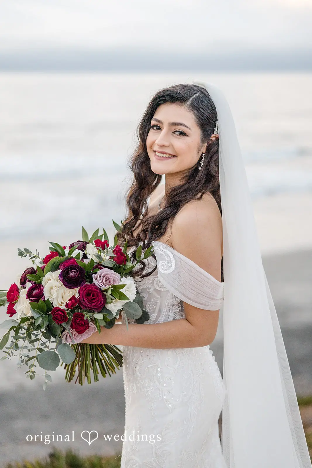 A stunning portrait of the bride holding her huge bouquet