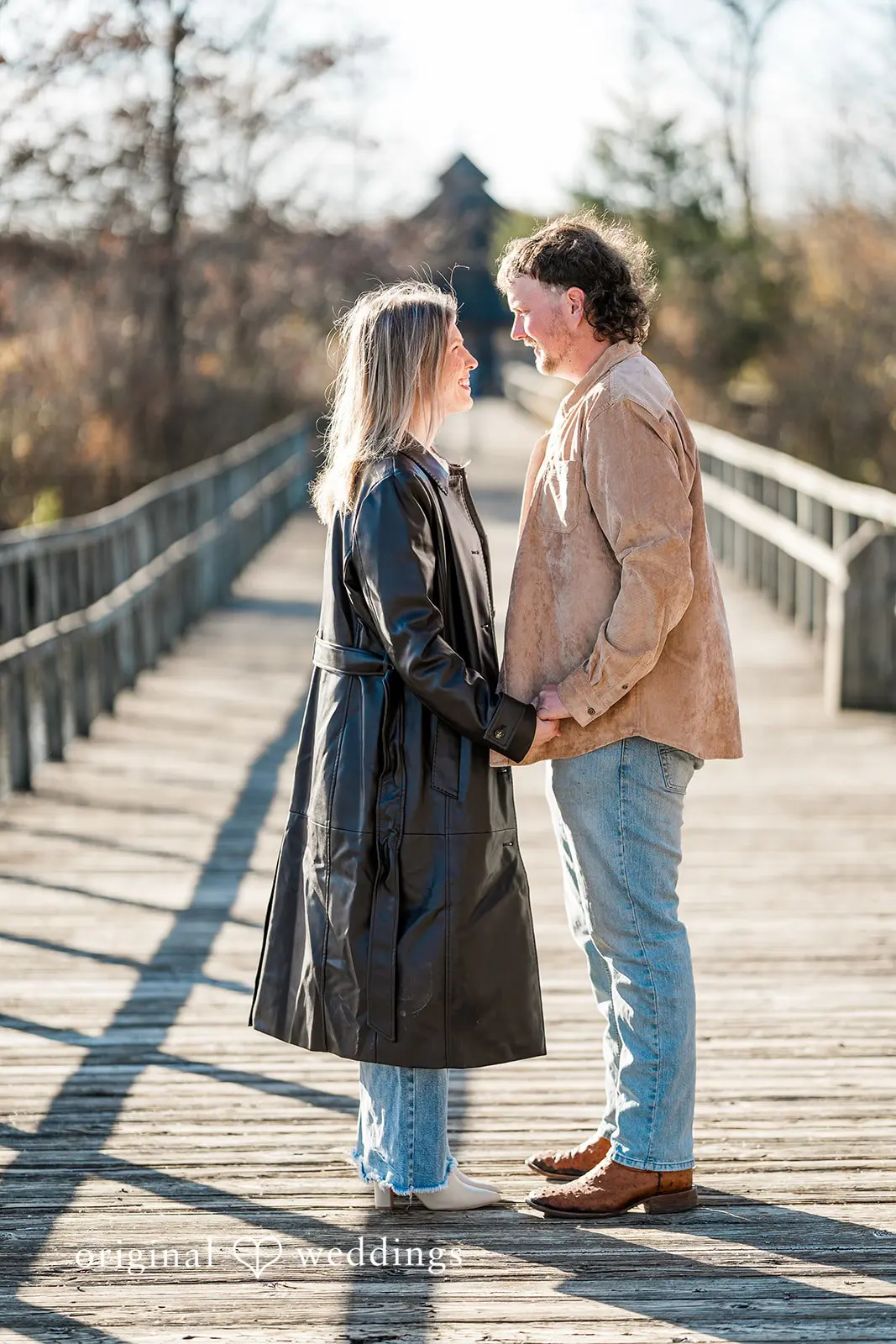 A portrait of the couple holding hands at Crosswind Marshes