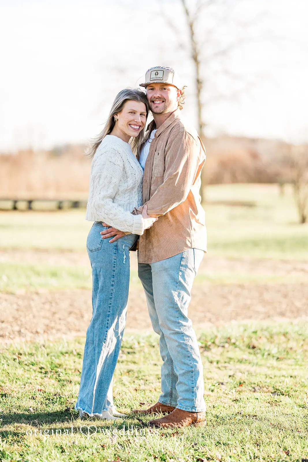 A stunning portrait of the couple at the field