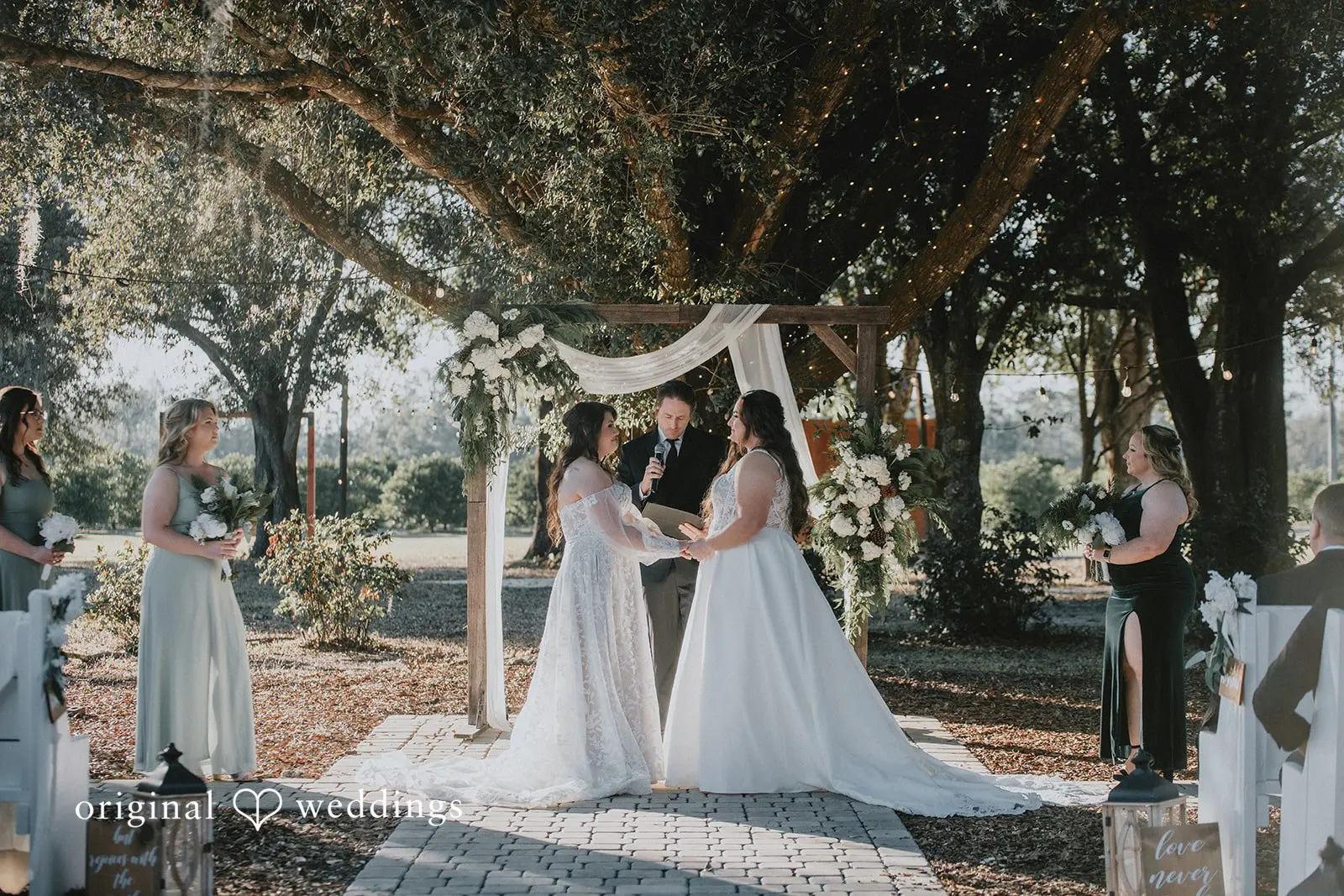 Marisa + Jessica Our Orlando wedding photographers captured a portrait of the couple exchanging marital vows at Ever After Farms Citrus