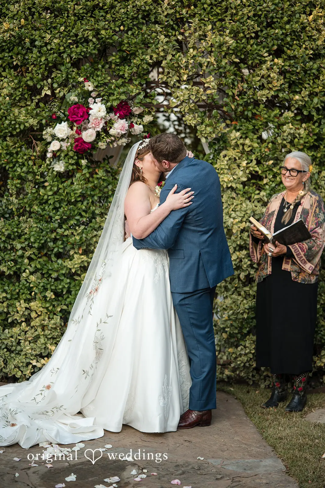 Ashley + David The bride and groom take their first kiss