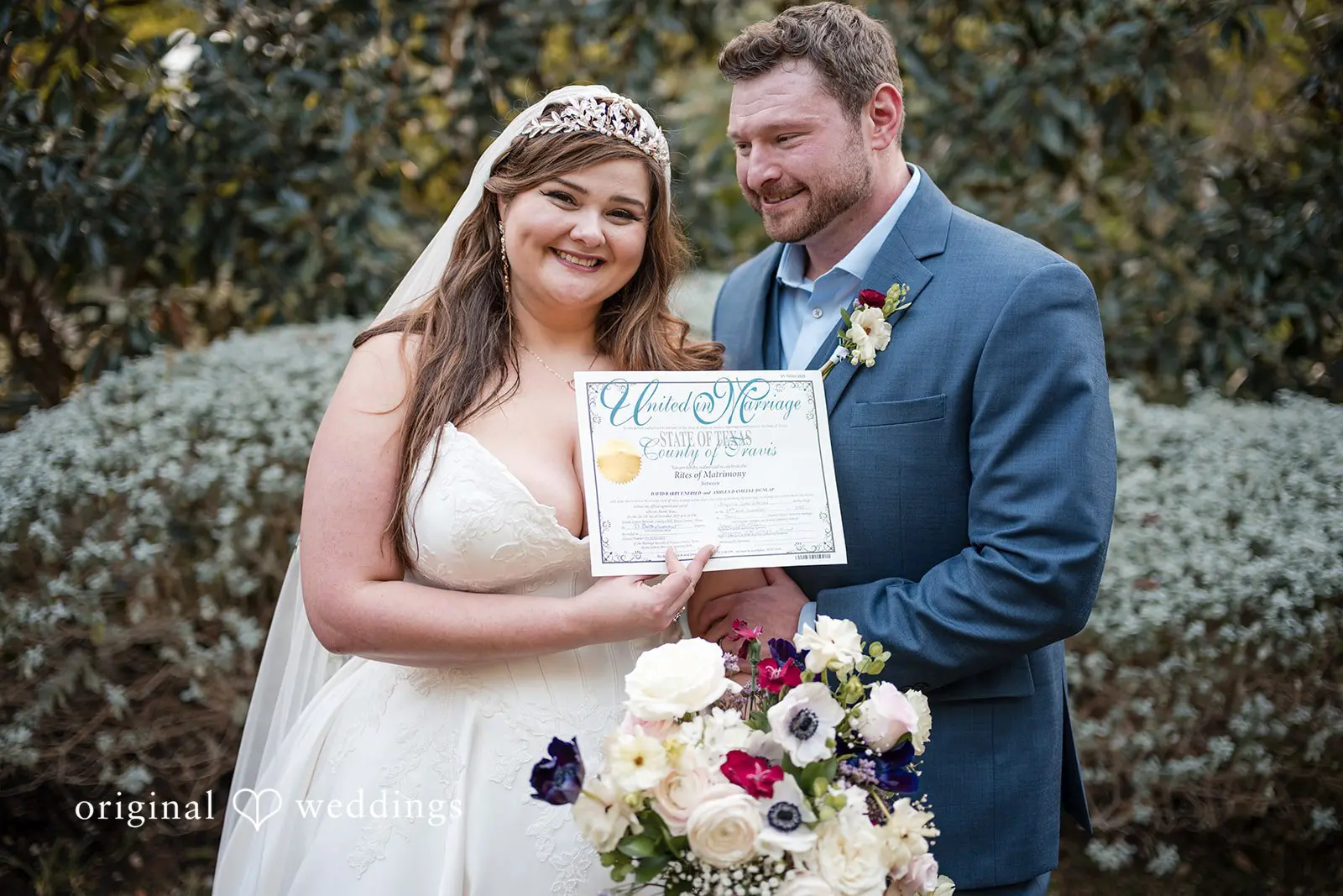 Ashley + David A portrait of the couple with their marriage certificate