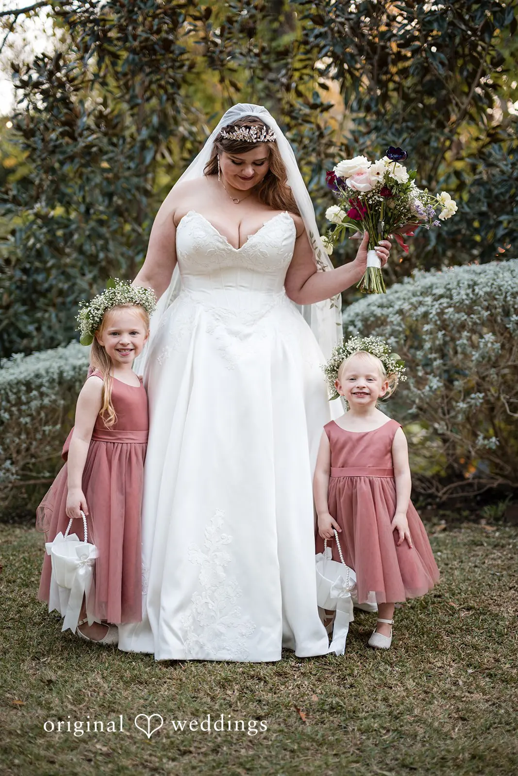 Ashley + David A portrait of the bride with her flower girls